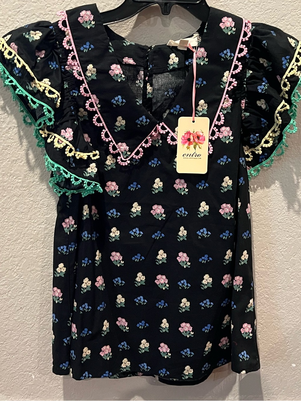 entro black floral blouse with pink, blue and cream blooms
